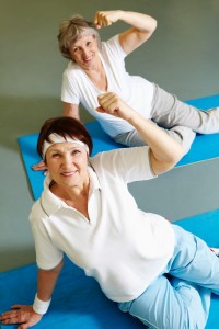 Women exercising on mat